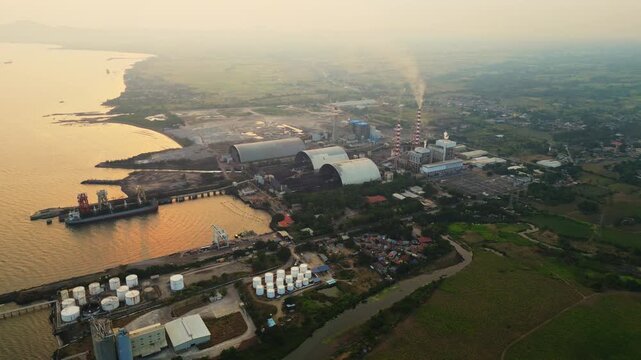 Calaca Powerplant Batangas Philippines &mdash; dramatic energy production facility during sunset with smoke emissions and cinematic industrial mood.