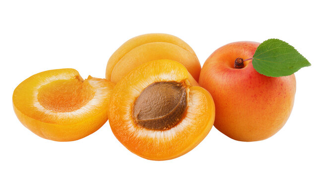 Ripe halved apricots with one whole apricot and green leaf