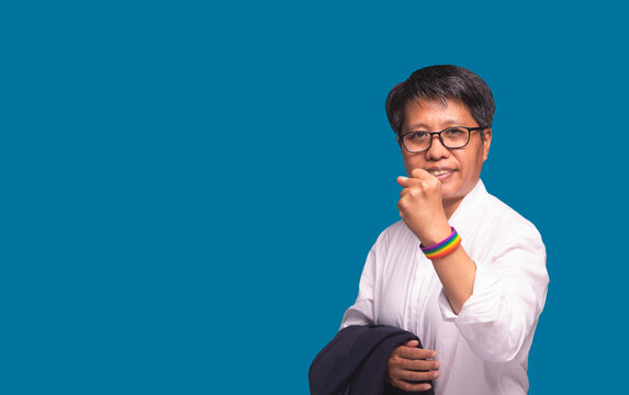 Smiling short hair businesswoman with pride identity