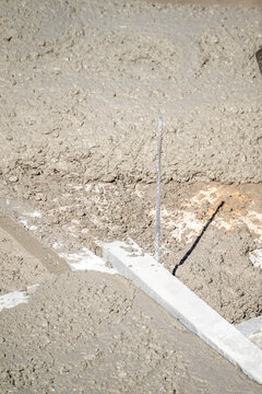 Freshly poured wet concrete on a construction site The Concept of foundation