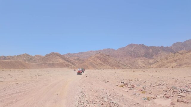 Driving a quad bike in the desert near Dahab, Egypt