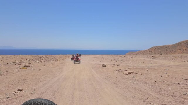 Driving a quad bike in the desert near Dahab, Egypt