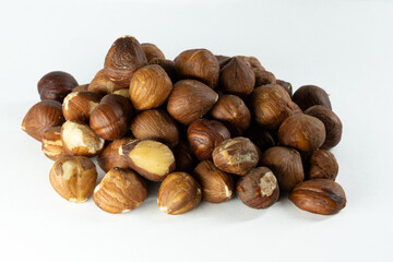 Fototapeta premium a pile of hazelnuts isolated on a white background