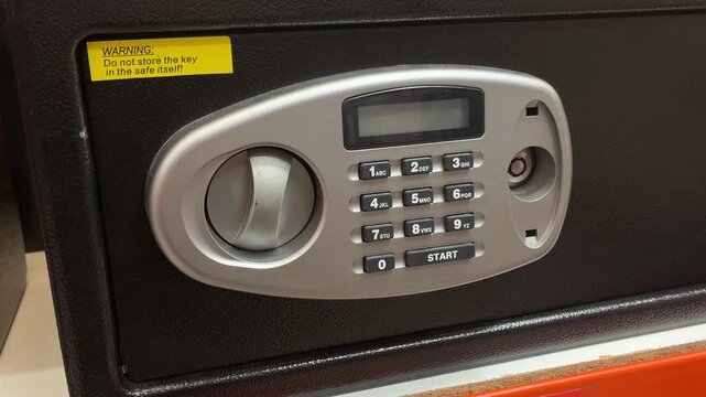 safe with combination lock on a black background