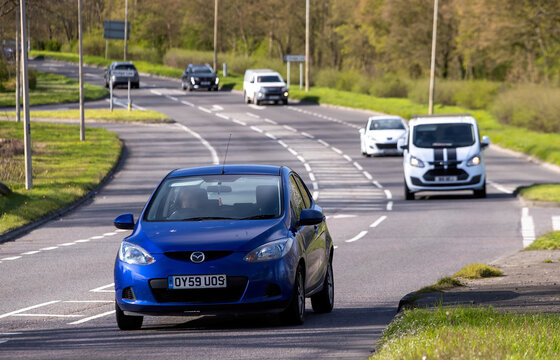 Milton Keynes,Bucks,UK - Mar 26th 2026:  2009 blue Mazda 2 car driving on a British road