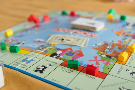 Monopoly game setup with pieces and cards