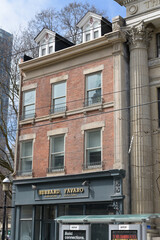 Obraz premium exterior building facade and sign of Hubbard Favaro, an attorney office, located at 142 King St E (historic building known as St Lawrence Galleries), Toronto