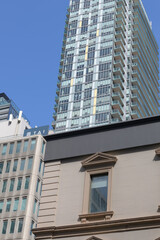 Fototapeta premium historic building window at 25 Toronto St contrast with Spire, a condominium complex, at 100 Church St, Toronto