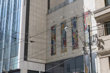 Fototapeta premium exterior of 1965 Bell Telephone Building designed by Marani, Morris & Allen, featuring integrated communication-themed glass mosaic panels by artist York Wilson embedded into the façade, Toronto