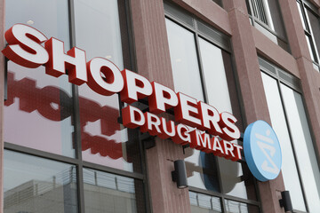 Naklejka premium building facade and sign of Shoppers Drug Mart, a pharmacy chain, located here at 401 Front St E, Toronto