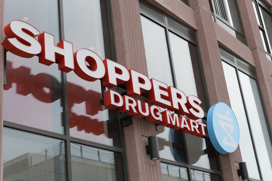 building facade and sign of Shoppers Drug Mart, a pharmacy chain, located here at 401 Front St E, Toronto