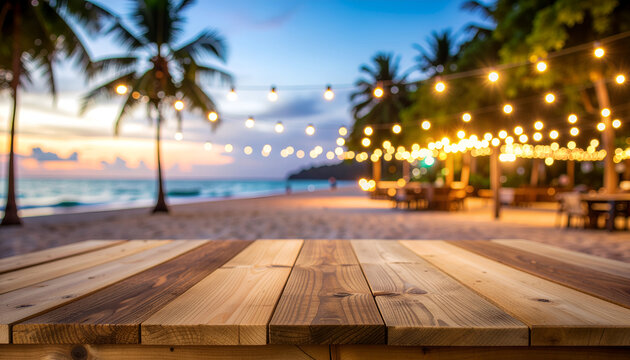 Tropical beach sunset with bokeh string lights and wooden table.