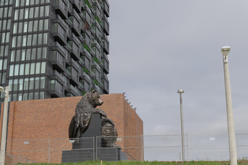 Naklejka premium wide view of Big Bear Park (Crosstown Park South), with sculpture by Dean Drever, Haida First Nation artist, at northwest corner of Eglinton and Don Mills, Toronto
