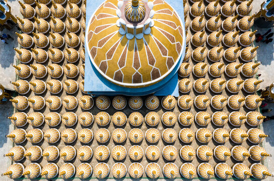 Aerial view of a grand mosque's golden central dome amidst hundreds of shimmering cupolas, Tangail, Dhaka Division, Bangladesh.