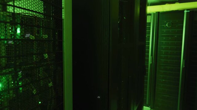 Camera panning right on input, revealing datacenter racks with LEDs blinking and numeric UI for ops