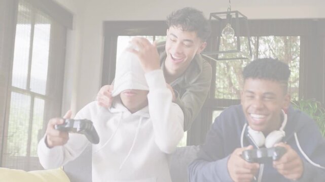 Vertical video: Reaching friend pulling hoodie over player in living room teasing pads and headset