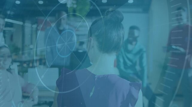 Vertical video: Presenter standing back to camera raising device and starting HUD for office review