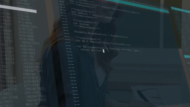 Female developer typing on keys at desk causing fading code overlay expanding while editing code