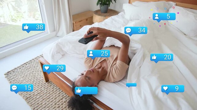 Woman lying on bed, phone tapping, tracking social badges growing into tens of fans around her