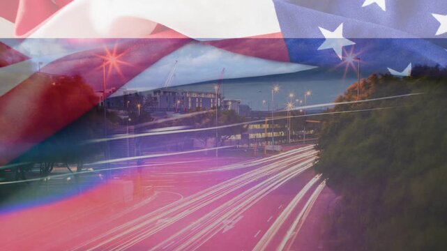US flag overlay starting first frame, waving and blending with highway trails for patriotic mood