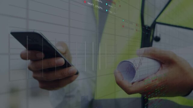 Vertical video: Shifting focus worker tapping phone on site with plans viewing data in vest hardhat