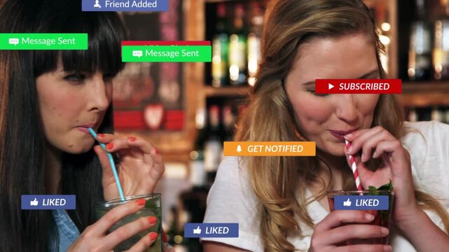 Two women bar sipping, stirring while social badges appearing clogging then fading, blonde focusing