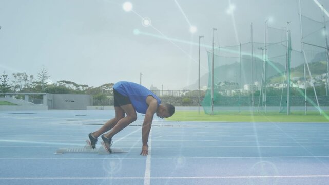 Male athlete reacting to start, beginning sprint and exploding from blocks, overlay mapping speed
