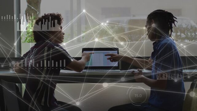 Two men pointing and tapping laptop trackpad starting animated tech visuals showing data