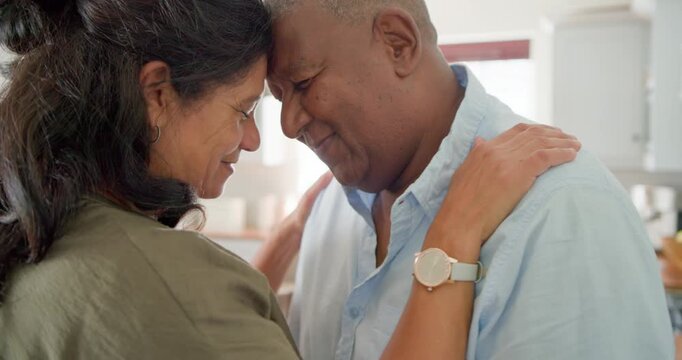 Couple stepping close, woman placing hands on man's shoulders seeking comfort at counter, hugging