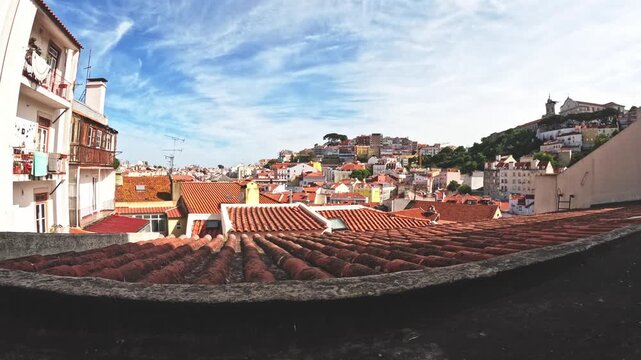 Lisbon Graca, Alfama and centre roof tops skyline time lapse, Portugal, old town. Morning to afternoon timelapse. Cathedrals, viewpoints and traditional tiles and Pombaline European architecture