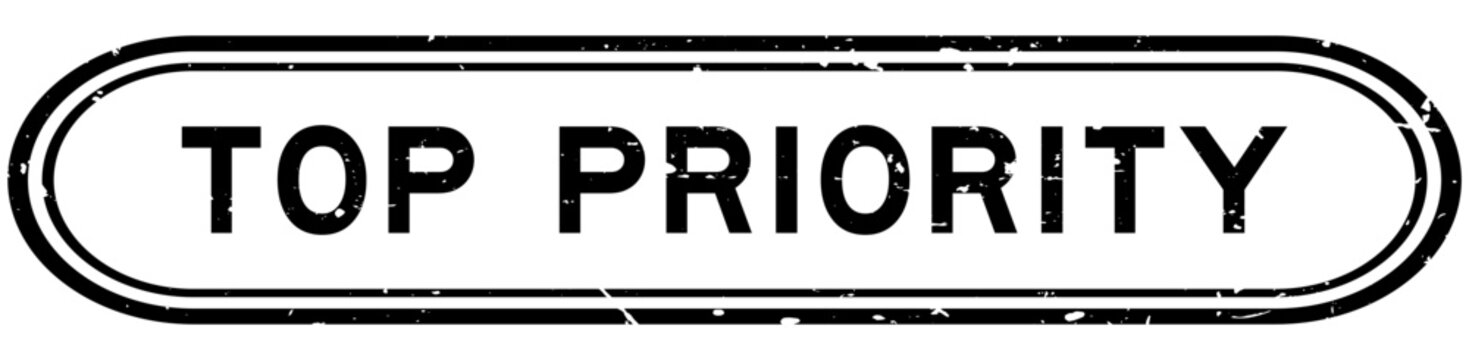 Grunge black top priority word rubber seal stamp on white background