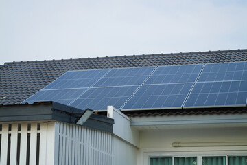 Fototapeta premium Solar panel installation residential roof urban setting clean energy daytime renewable technology