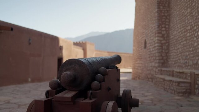Slow Motion Historic Cannon at Nakhal Fort, Cinematic Detail of Omani Defensive Weaponry and Fortifications