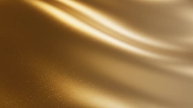 Elegant gold metallic texture background with soft light gradients and smooth surface.