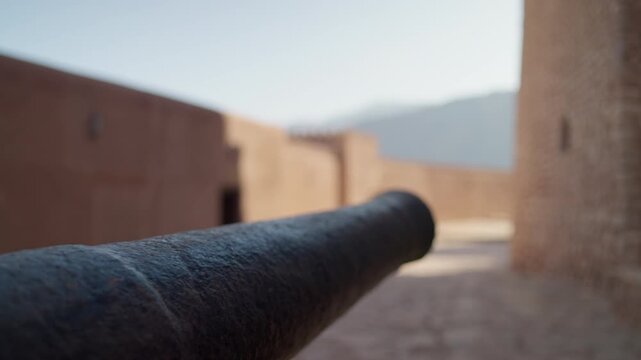 Slow Motion Historic Cannon at Nakhal Fort, Cinematic Detail of Omani Defensive Weaponry and Fortifications