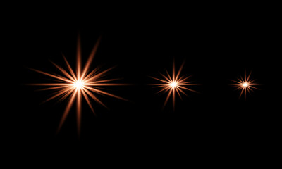 Fototapeta premium Three bright starbursts against a black background