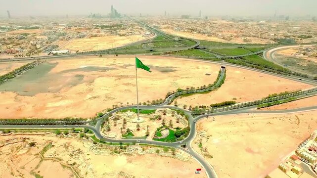 Panoramic Drone View of Riyadh City Skyline Featuring Kingdom Centre and Urban Traffic
