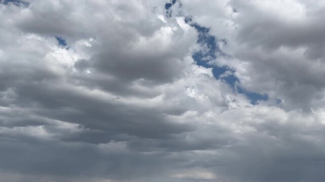 Magical view of cumulus clouds in blue sky. Natural view of white clouds in stunning blue sky. Perfect background for natural concepts. Puffy cumulus cloud relaxation weather Winter time.