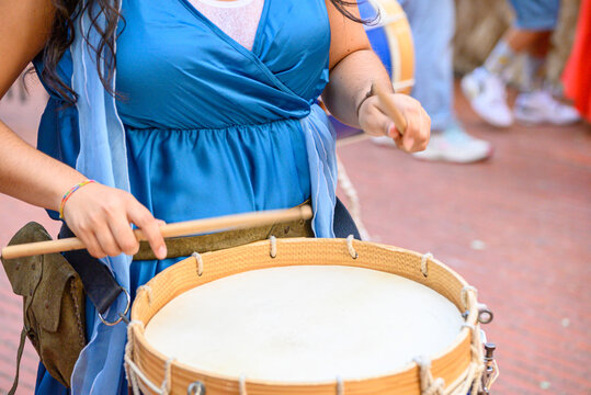 Female drummer performing in a street parade The Concept of musical passion