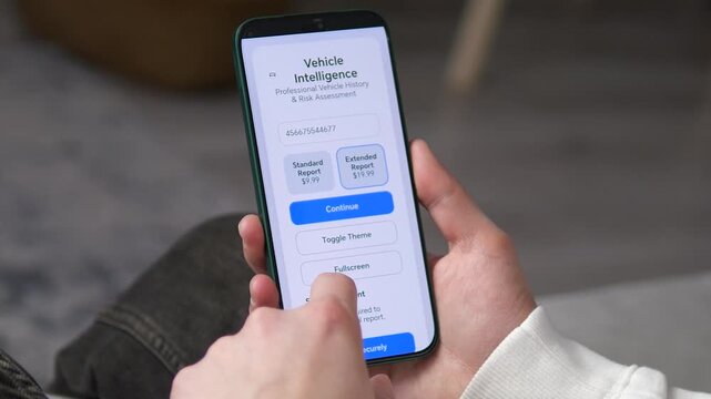 User purchasing an extended car history report on a smartphone app. High-quality footage of mobile vehicle assessment, VIN checking, and technical data review. Ideal for automotive services, finance