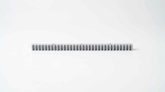 Close-up of a long metal rack and pinion gear component on a white background