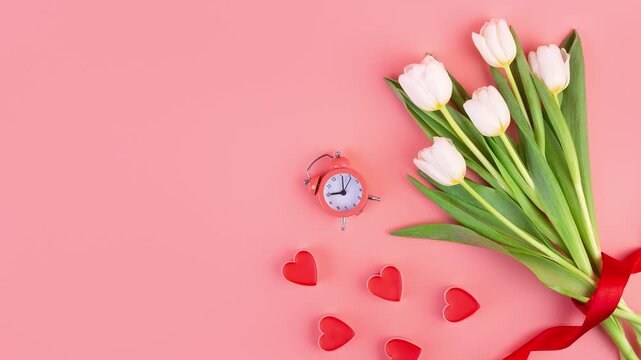 White Tulips and Red Hearts Arrangement with Vintage Alarm Clock on Pink Background