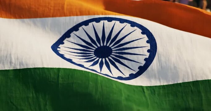 Indian national flag waving in the wind against a blurred background