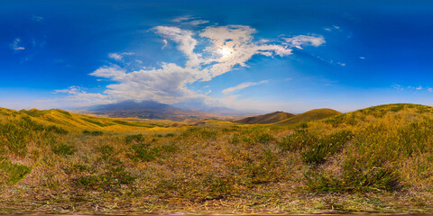 Fototapeta premium Expansive panoramic 360 view of rolling grassy hills and mountains
