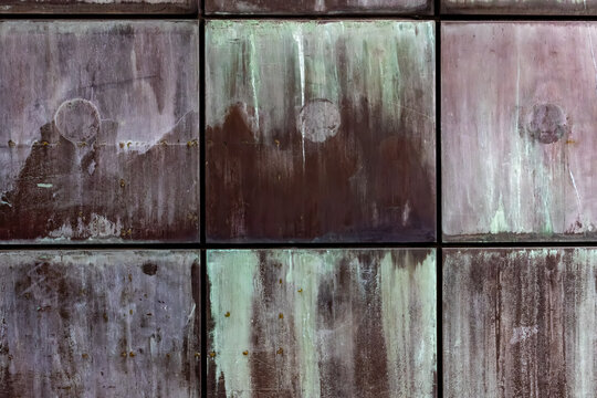 Weathered metal panel texture with stains and oxidation