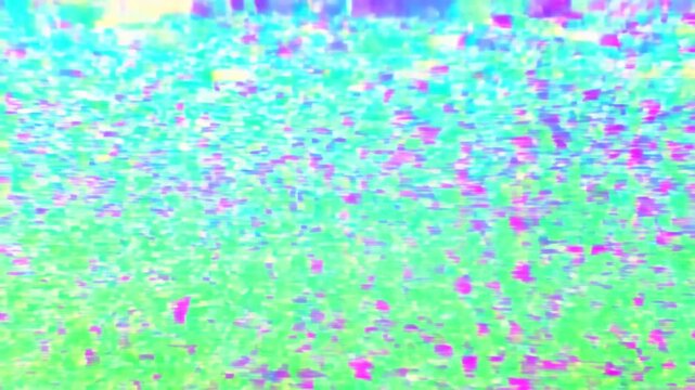 Static shot of colorful digital glitch noise flickering across television monitor display panel in studio closeup