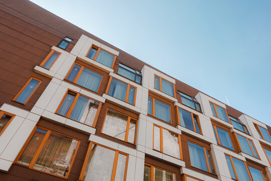 Residential building architecture facade detail against blue sky in Poznan Poland