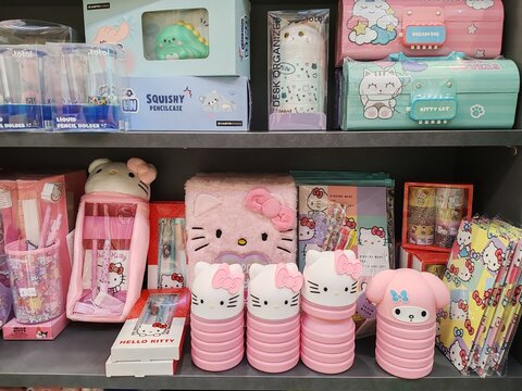 Rome, Italy - September 12, 2025, detail of a shelf full of school supplies, including Hello Kitty, a fictional character created by the Japanese company Sanrio, and Stitch.