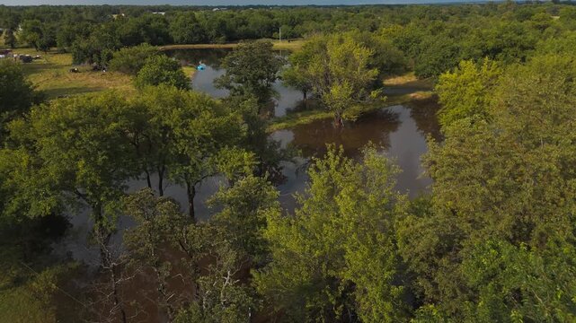 Serene Lake With Dense Forests Under Cloudy Sky Near Gentry, Arkansas, United States. Aerial Drone Shot