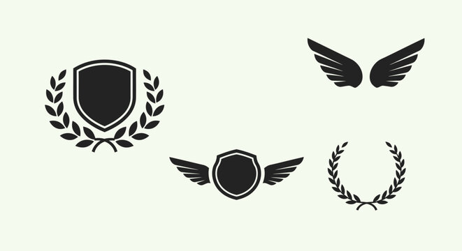Set of Heraldic Emblems with Shield, Wings, and Laurel Wreath, isolated white background